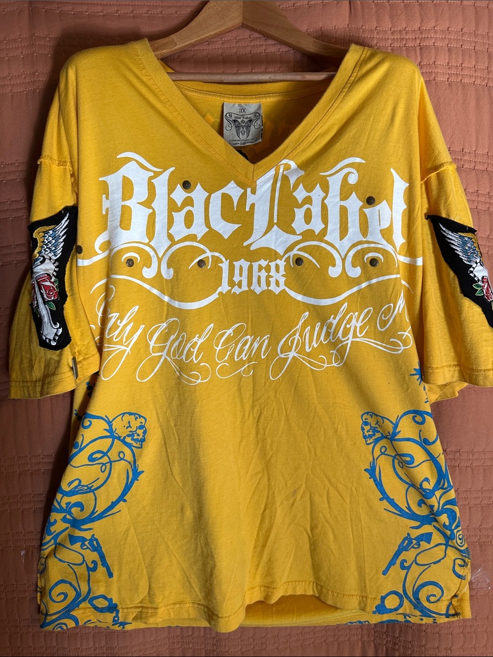 Black Label Yellow V-Neck Graphic Tee with White Script and Blue Scrollwork